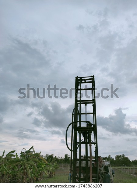 Water\
well drilling equipment, On the back of the\
car.