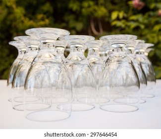 Water Wine Glasses Lined Up On A White Table Cloth