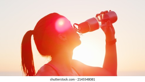 Water Is Your Best Fitness Buddy. Cropped Shot Of An Attractive Young Woman Drinking Water While Working Out Outdoors.