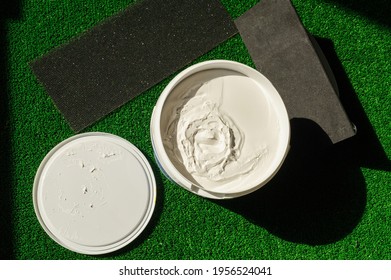 Water-based Paint Repair Concept. White And Yellow Paint On Artificial Grass. Paint, Concept,