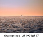 Waterboarding during early morning sunrise on Lake Ontario along Burlington beach in Ontario, Canada