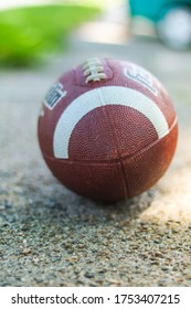 Waterbury, CT/USA-6.8.20: Brown Football On The Sidewalk