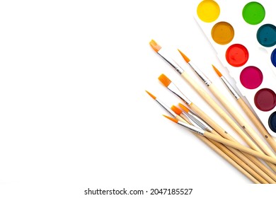 watercolor paints and brushes on a white background copyscape. High quality photo