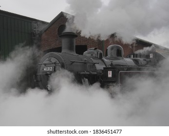 Watercress Line Loco Wreathed In Steam.