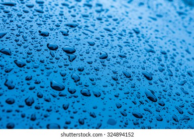 Waterdrops On Blue Car Paint As Underground