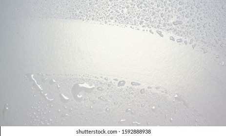 Waterdrops on clean glass surface
				