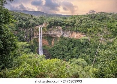 The waterfall is 80m high and falls into a gorge. View of tropical nature and landscape of Chamarel double waterfall in Black River National Park in Mauritius. - Powered by Shutterstock