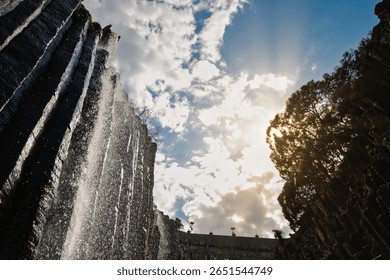 Waterfall and basalt columns under dramatic sky at Prismas Basalticos, Hidalgo, Mexico