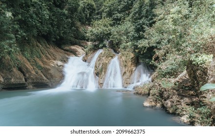 waterfall with blue water and smooth stream.