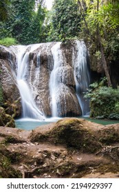 Waterfall Cascade On The Mountain Rock With Muddy Surface 