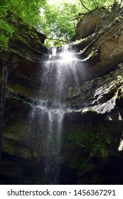 A waterfall cascades over rocks.