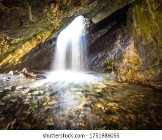 Waterfall Cascading down a in Cave