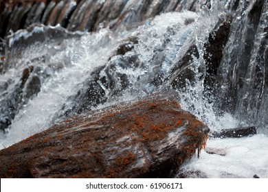 Waterfall Close Up. Water Cascade On Moss Stones