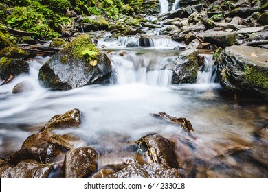 Waterfall Close Up. Water Cascade On Moss Stones