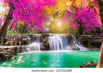 Waterfall colorful leaves in the summer is a beautiful waterfall with clear, flowing water, soft, emerald green color, suitable for relaxing, playing,