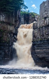 Waterfall With Dirty Water; High Force Is One Of The Biggest Waterfalls In England And Is Popular By Tourists. High Force Is Located Near Middleton-in-Teesdale In The North Pennines, England. 