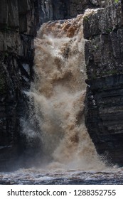 Waterfall With Dirty Water; High Force Is One Of The Biggest Waterfalls In England And Is Popular By Tourists. High Force Is Located Near Middleton-in-Teesdale In The North Pennines, England. 