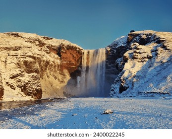 Iceland’s Skógafoss waterfall during the winter.