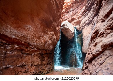 Waterfall At The End Of A Slot Canyon Hike In Moab, Utah