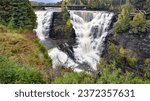 Waterfall with fall foliage and creamy water