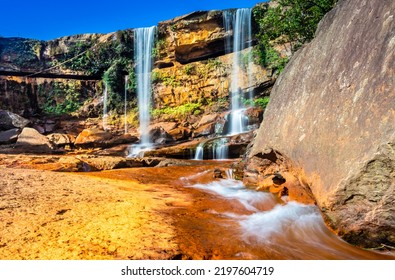 Waterfall Falling From Mountain Top With Blue Sky At Morning From Unique Angle