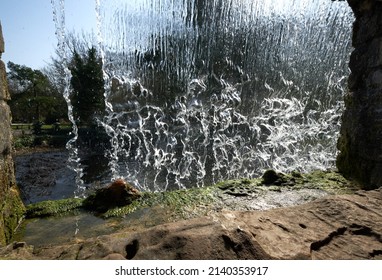 Waterfall flowing into a pond scene