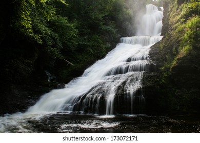 A waterfall in a forest.  Dingman's Falls, Delaware Water Gap National Recreation Area, PA, USA.
