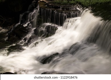 A Waterfall In A Forest.  Old Stone Fort State Archaeological Park, Manchester, TN, USA.