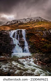 A Waterfall In Glencoe With A Stormy Sky, Scotland, UK