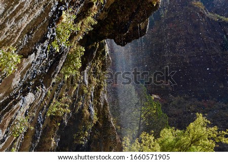 a waterfall going down the mountian