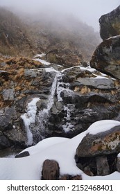 Waterfall In High Hills Covered By Snow  Waterfall, Snowfall In Hills, Mountains, Rocks