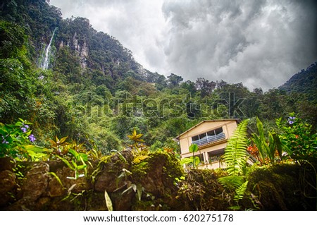 Waterfall and house