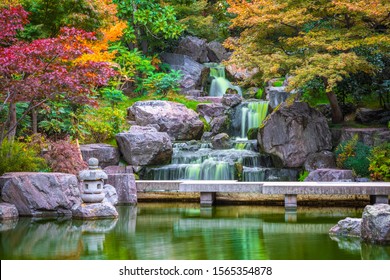 Waterfall at Kyoto garden in Holland park in London during autumn