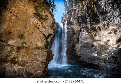 Waterfall landscape on sunny summer day in Johnston Canyon in Banff National Park, Alberta Canada - Powered by Shutterstock