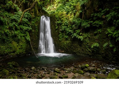 Waterfall In Lush Tropical Forest On The Azores