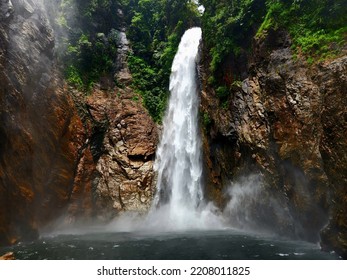 Waterfall Malaysia with strong water current surrounded by lush green jungle - Shutterstock ID 2208011825