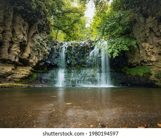 waterfall in the middle of the forest. 