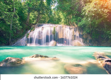 Waterfall named Erawan at 2th level. That famous attraction of Kanjanaburi province of Thailand. It represents landscape, scenic, cascade, nature and forest for travel background.