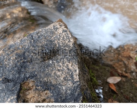 Waterfall. Natural continuous waterstream with source from mountain.