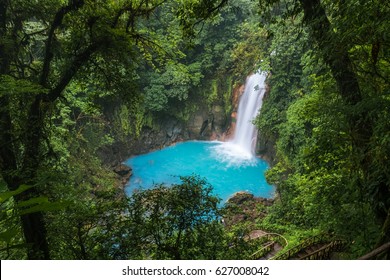 Waterfall and natural pool with turquoise water of Rio Celeste, Costa Rica - Powered by Shutterstock