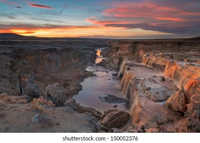 a waterfall in the Navajo desert, Arizona at sunset