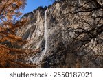 Waterfall on a cliff in the Swiss alps in a sunny November day