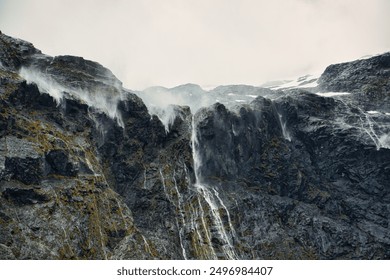 Waterfall on the drive to Milford Sound - Powered by Shutterstock