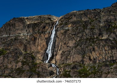 Waterfall On Flat Rock Face