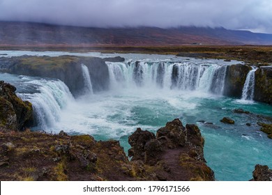 Goðafoss Waterfall on a gloomy and misty autumn afternoon