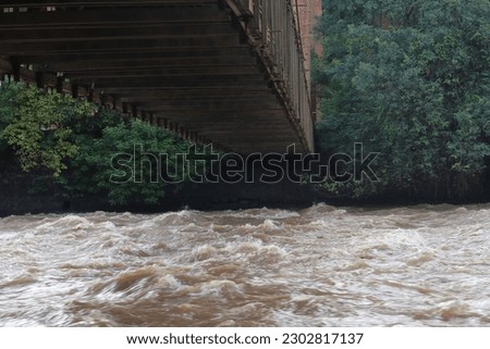 Waterfall on the Piracicaba River. Piracicaba river with high water level. Turbulent waters.
