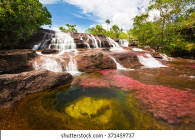 Waterfall on the red Cristales river, Colombia, jungle
