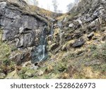 Waterfall on rocky outcrop Crompton Moor