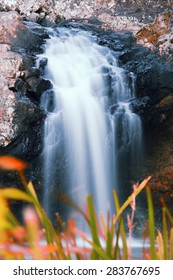 Waterfall With Orange And Red Colours In The Gold Coast Hinterlands On The Queensland And New South Wales Border. 