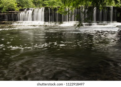 A Waterfall Over A Dam.  Old Stone Fort State Archaeological Park, Manchester, TN, USA.